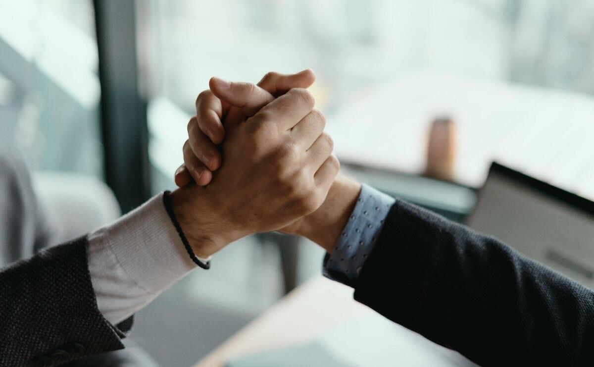 Two business men celebrating a deal