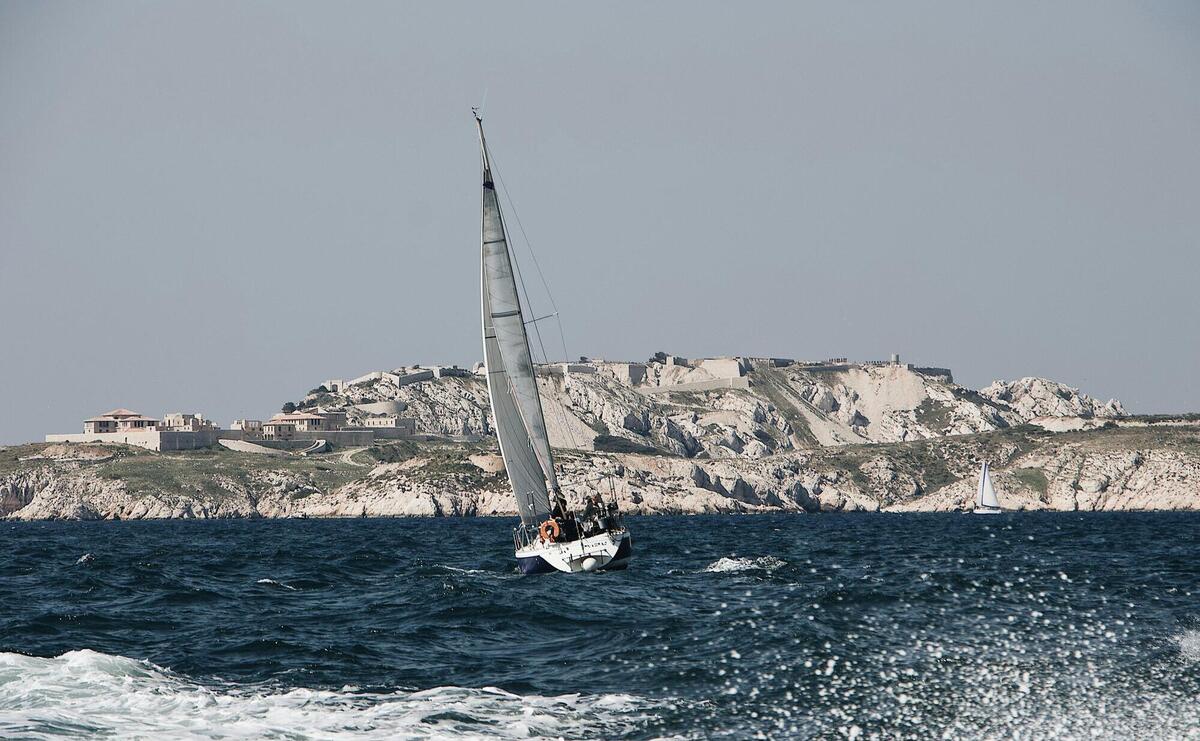 white sailboat on ocean